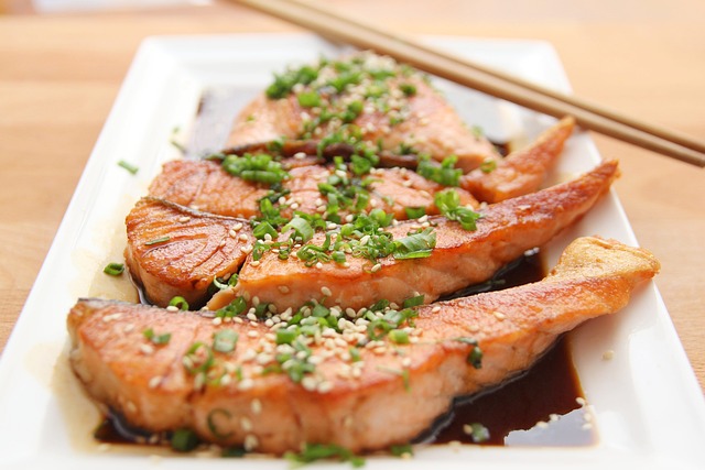 Juicy Salmon on a plate with teriyaki sauce.